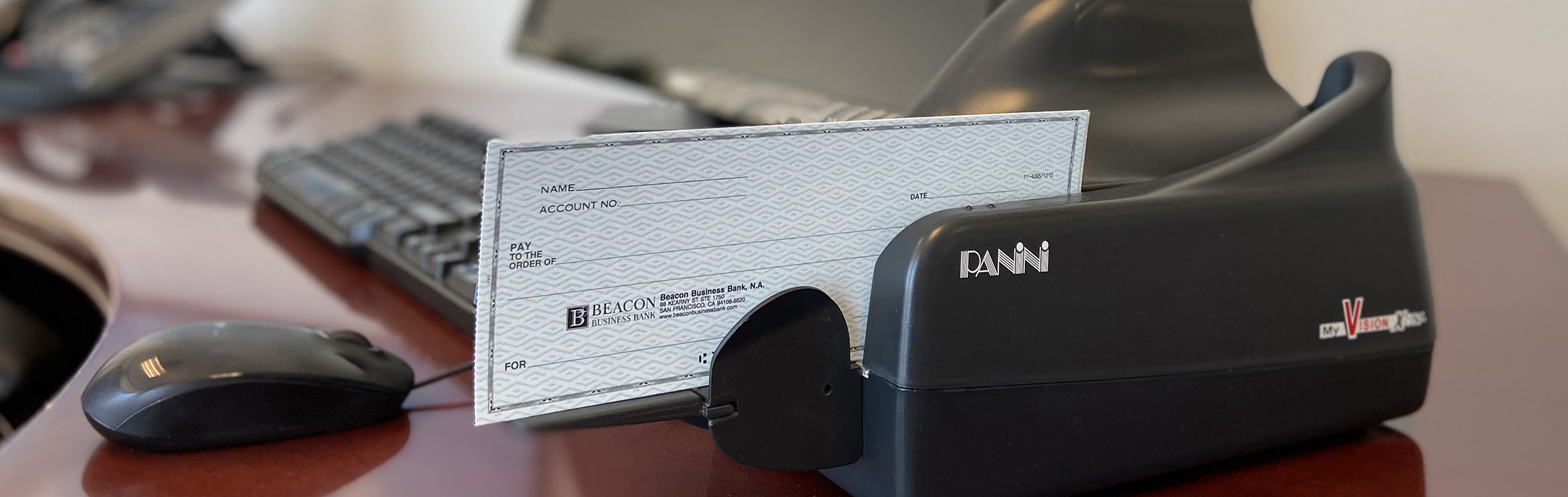 photo of a panini remote deposit check scanner on a desk