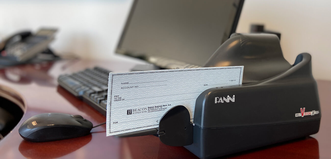 image of a panini desktop scanner with checks